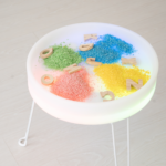 Lumi'sense Interactive Light-Up Sensory Table filled with sensory table filling