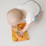 liquid filled sensory pad with kid playing