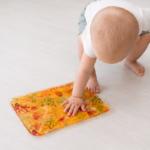 liquid filled sensory pad touching by kid